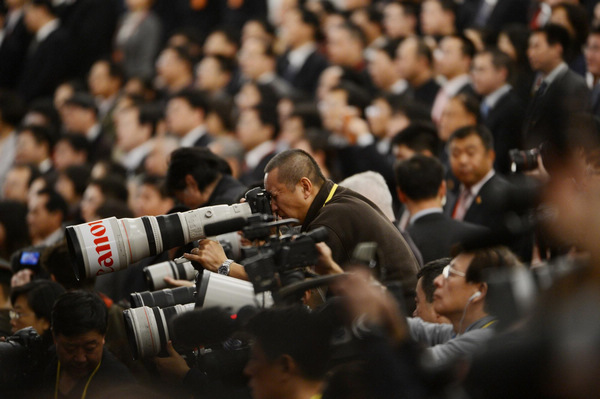 Photographers take photos of the opening ceremony of the 18th National Congress of the Communist Party of China (CPC) at the Great Hall of the People in Beijing, capital of China, Nov 8, 2012. Journalists cover opening ceremony of CPC congress