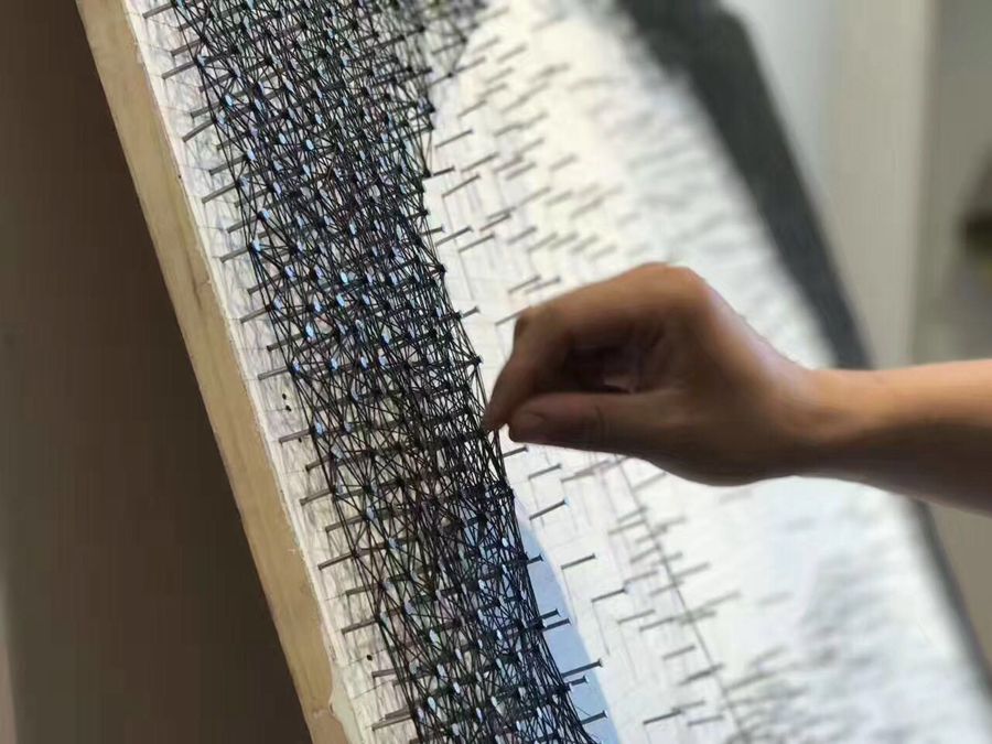 Wuhan student recreates Marilyn Monroe portrait using only nails and string