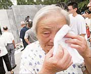 Yang Cuiying, a survivor of the Nanjing Massacre, cries as she mourns for her relatives killed by Japanese troops in the 1937 massacre. A memorial event was held yesterday at the Memorial Hall of the Victims in Nanjing Massacre by Japanese Invaders, to commemorate the 74th anniversary of the September 18 Incident, which marked the start of the Japanese annexation of Northeast China in 1931.