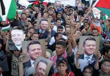 Jordanians attend a rally in support of Jordan's King Abdullah outside the Grand Hyatt hotel in central Amman November 10, 2005.