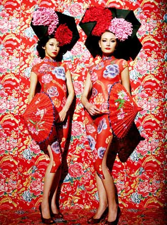 Models wearing body paint in the style of Chinese Qi Pao dress pose in front of a tableau at a Chinese New Year celebration MAC fashion show in New York February 2, 2006. The elaborate makeup applications took up to eight hours to apply on the topless models who then posed in front of backdrops at a cocktail party. The show kicks off Fashion Week which starts on Friday.
