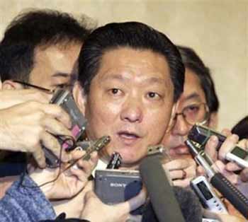 North Korean negotiator Song Il Ho is durrounded by reporters prior to his meeting with Japanese counterparts on Monday February 6, 2006 in Beijing, China.