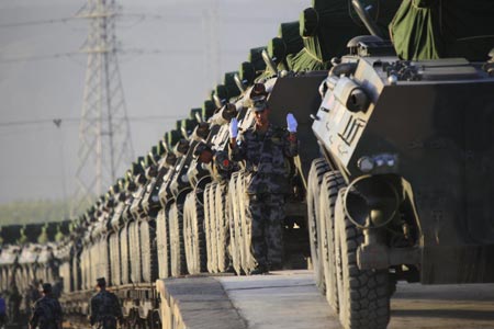 Chinese army military vehicles are transported by railway for the exercise of