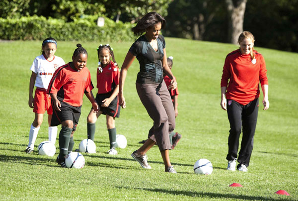First lady Michelle Obama hosts a Let's Move! clinic with members of the US women's soccer team to teach kids soccer skills and highlight the importance of physical activity on the South Lawn of the White House in Washington October 6, 2011. US first lady shows off soccer skills at WH