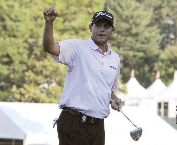 Bill Haas of the United States celebrates after winning the Tour Championship and the FedEx Cup in a sudden death playoff with Hunter Mahan at East Lake Country Club, during the final round of the Tour Championship PGA golf tournament in Atlanta, Georgia, Sept 25, 2011. Initial jackpot confusion for Haas on payday to remember