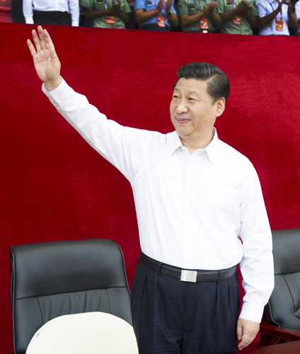 President Xi Jinping, who is also the general secretary of the Communist Party of China Central Committee and chairman of the Central Military Commission, waves to the audience during the opening ceremony of the 12th National Games at the Olympic Sports Center in Shenyang, Northeast China's Liaoning province, Aug 31, 2013. Games start is grand, without grandstanding