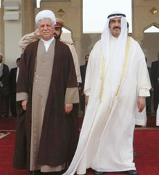 The Head of the Islamic Republic of Iran's Expediency Council Hashimi Rafsanjani, left, stands besides Kuwaiti Prime Minister Sheikh Nasser Al-Mohammad Al-Ahmad Al-Sabah at Kuwait International Airport after his arrival to Kuwait on Sunday, April 16, 2006. (AP