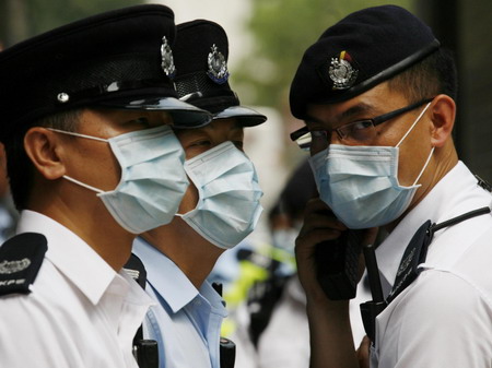 Travellers are quarantined in Hong Kong hotel