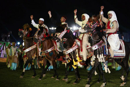 Hugs from Chavez as Gaddafi's Libya reaches 40