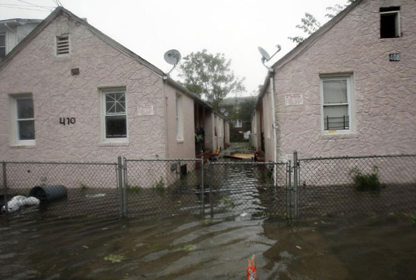 Flood waters caused by Hurricane Irene surround homes in the Rockaway beach section of Queens, New York August 28, 2011. Commuting nightmare after Irene floods northeast