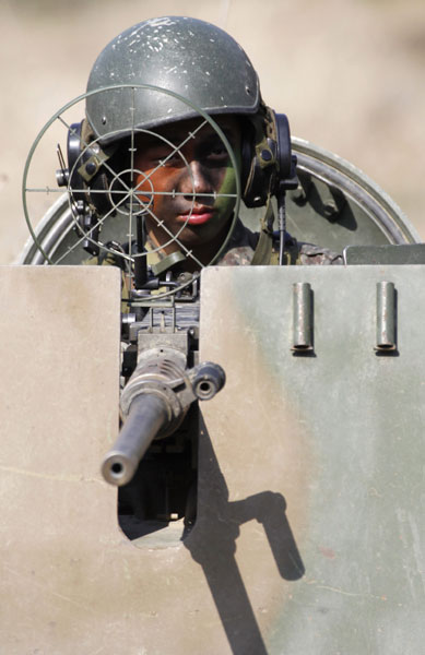 An ROK soldier in an armored vehicle participates in a joint military drill with soldiers of the United States near the Demilitarized Zone of the Korean Peninsula on Wednesday in Paju, north of Seoul. Lee Jae-Won / Reuters Seoul delivers ultimatum to DPRK